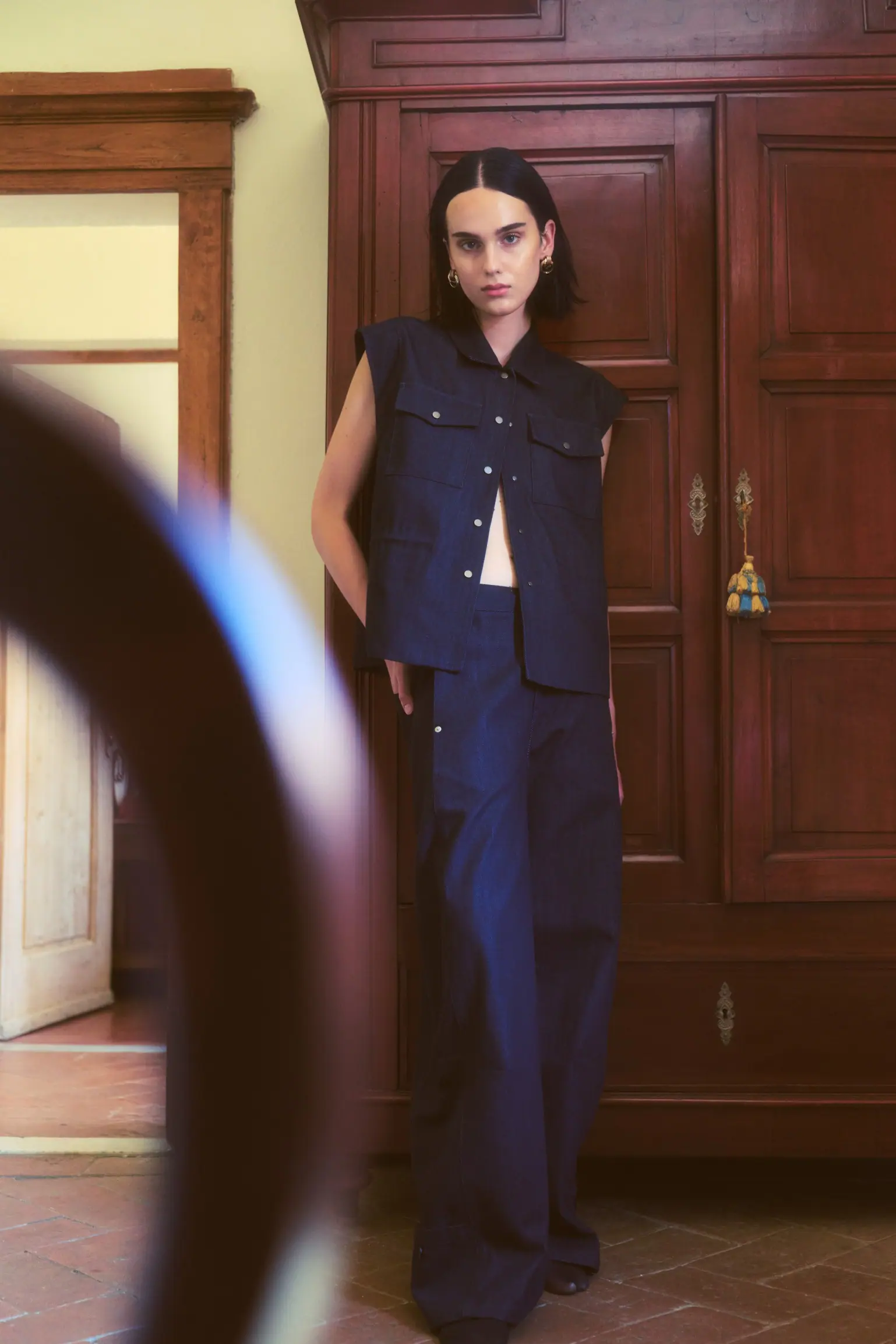 Portrait of the woman in tailored suiting in soft natural light.
