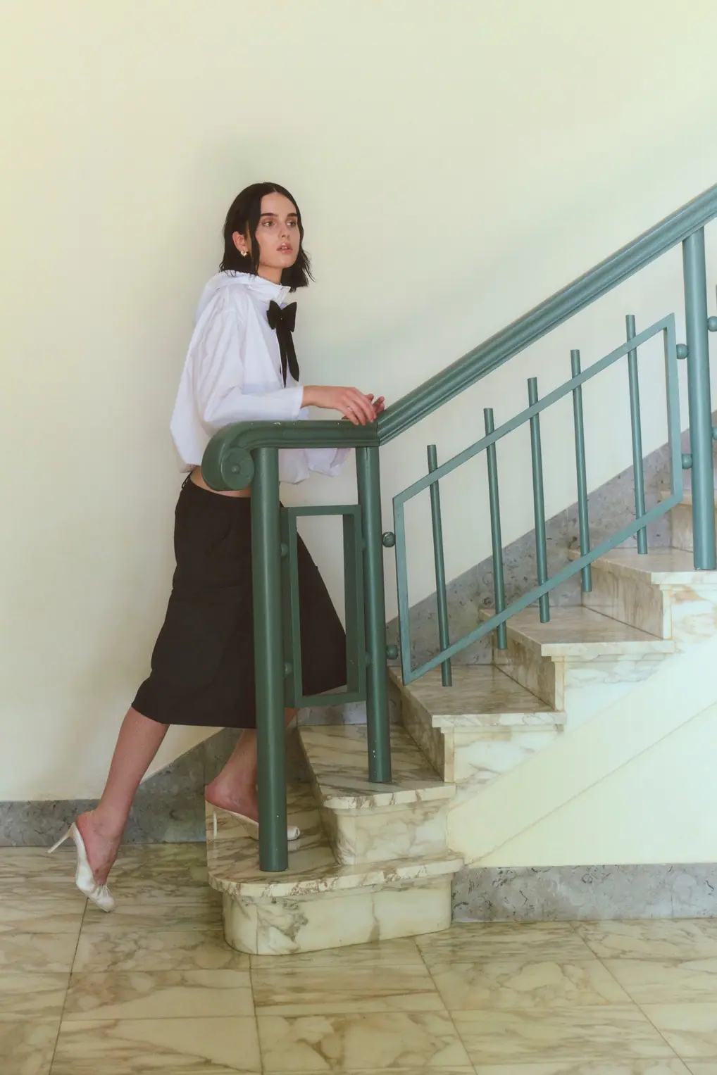 A detail of the woman in a tailored look.